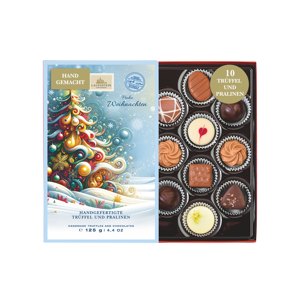 Geöffnete Lauenstein Geschenkpackung mit weihnachtlichem Einschieber und Aufschrift Frohe Weihnachten sowie 10 alkoholfreien Pralinen