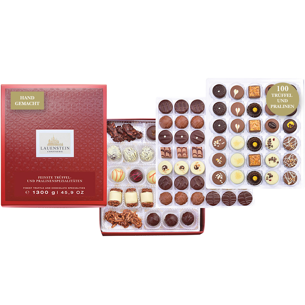 Elegante rote Pralinenschachtel von Lauenstein mit erlesenen Trüffeln und kunstvoll dekorierten Schokoladenpralinen in verschiedenen Sorten und Formen.  