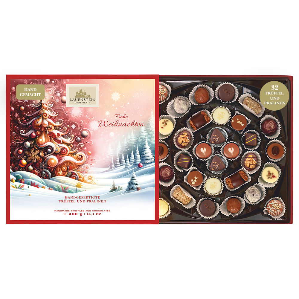 Geöffnete Lauenstein Geschenkpackung mit weihnachtlichem Einschieber und Aufschrift Frohe Weihnachten, sowie 32 sortierten Pralinen
