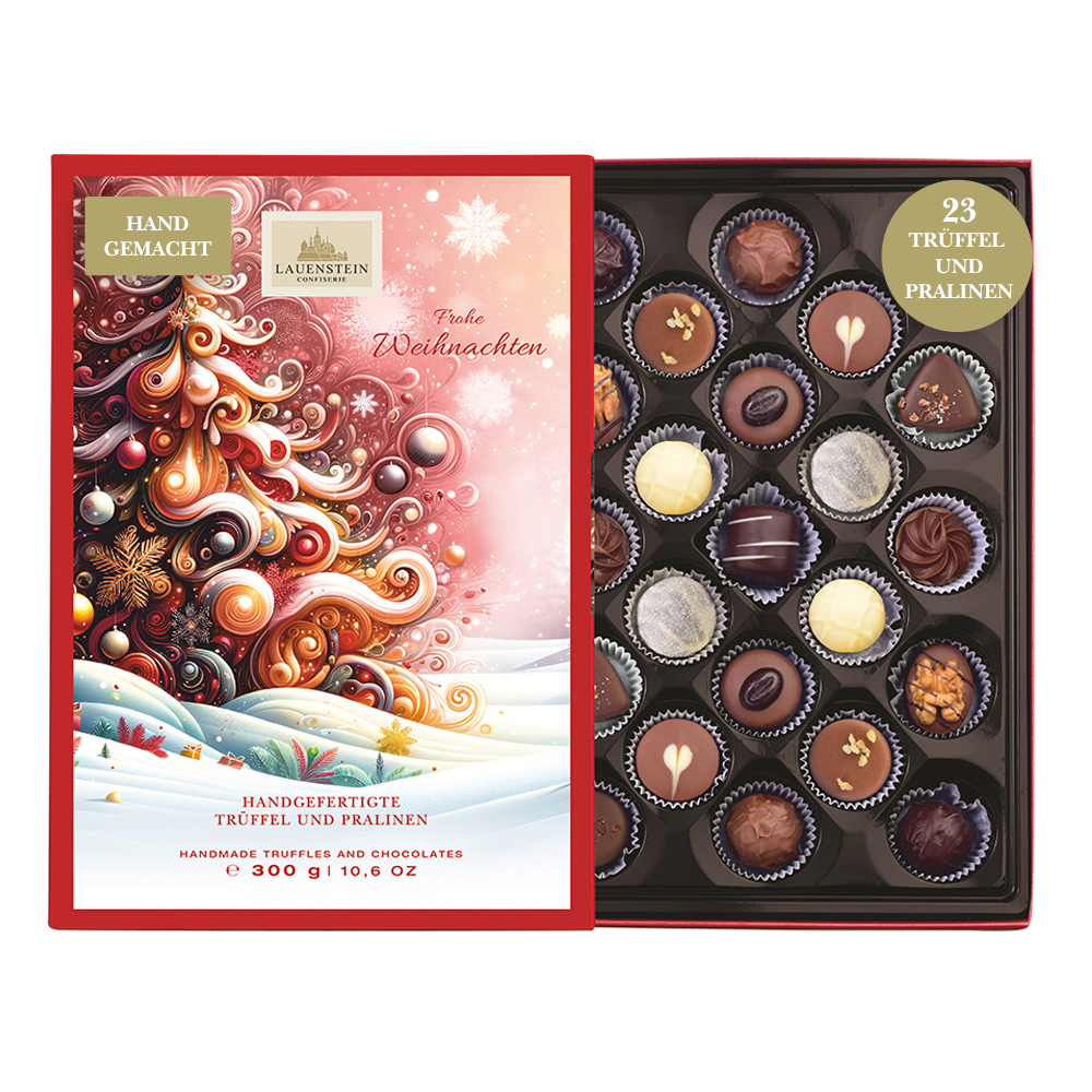 Geöffnete Lauenstein Geschenkpackung mit weihnachtlichem Einschieber und Aufschrift Frohe Weihnachten sowie 23 sortierten Pralinen