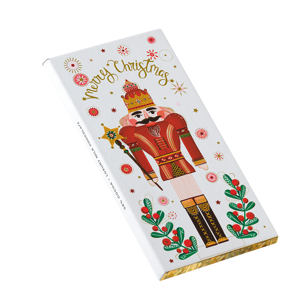 Weiße Turnowsky Schokoladentafel-Verpackung mit festlichem Nussknacker-Motiv und dem Schriftzug Merry Christmas