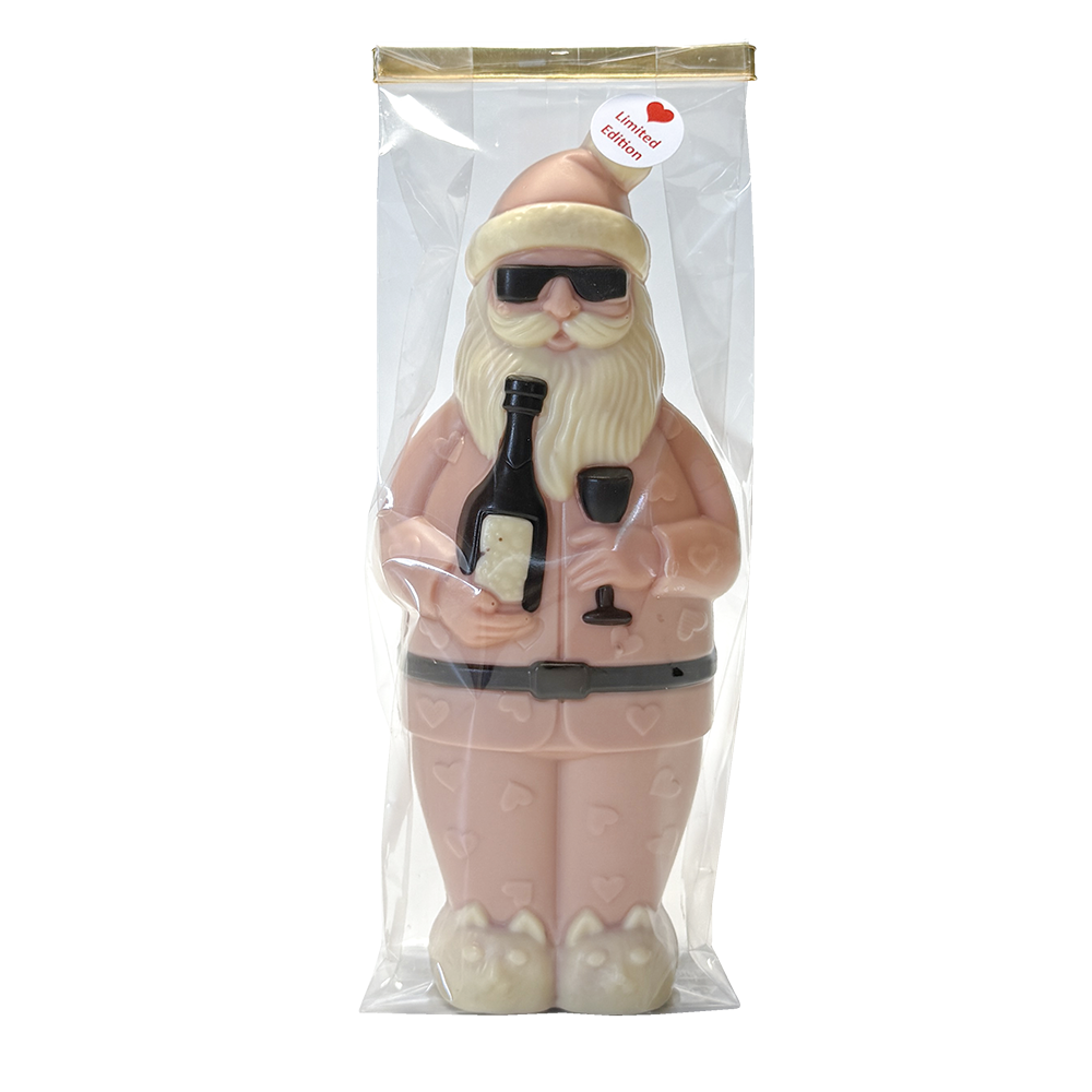 rosa Weihnachtsmann-Schokoladenfigur in Pyjama mit Sonnenbrille, Sektflasche und Sektglas