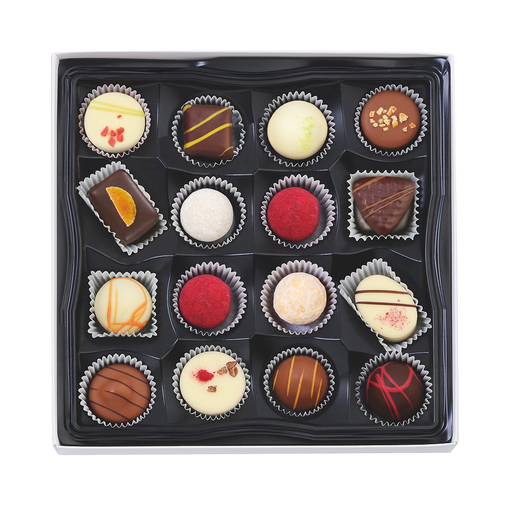 Schwarze Pralineneinlage mit 16 handgefertigten fruchtigen Trüffeln und Pralinen in verschiedenen Sorten