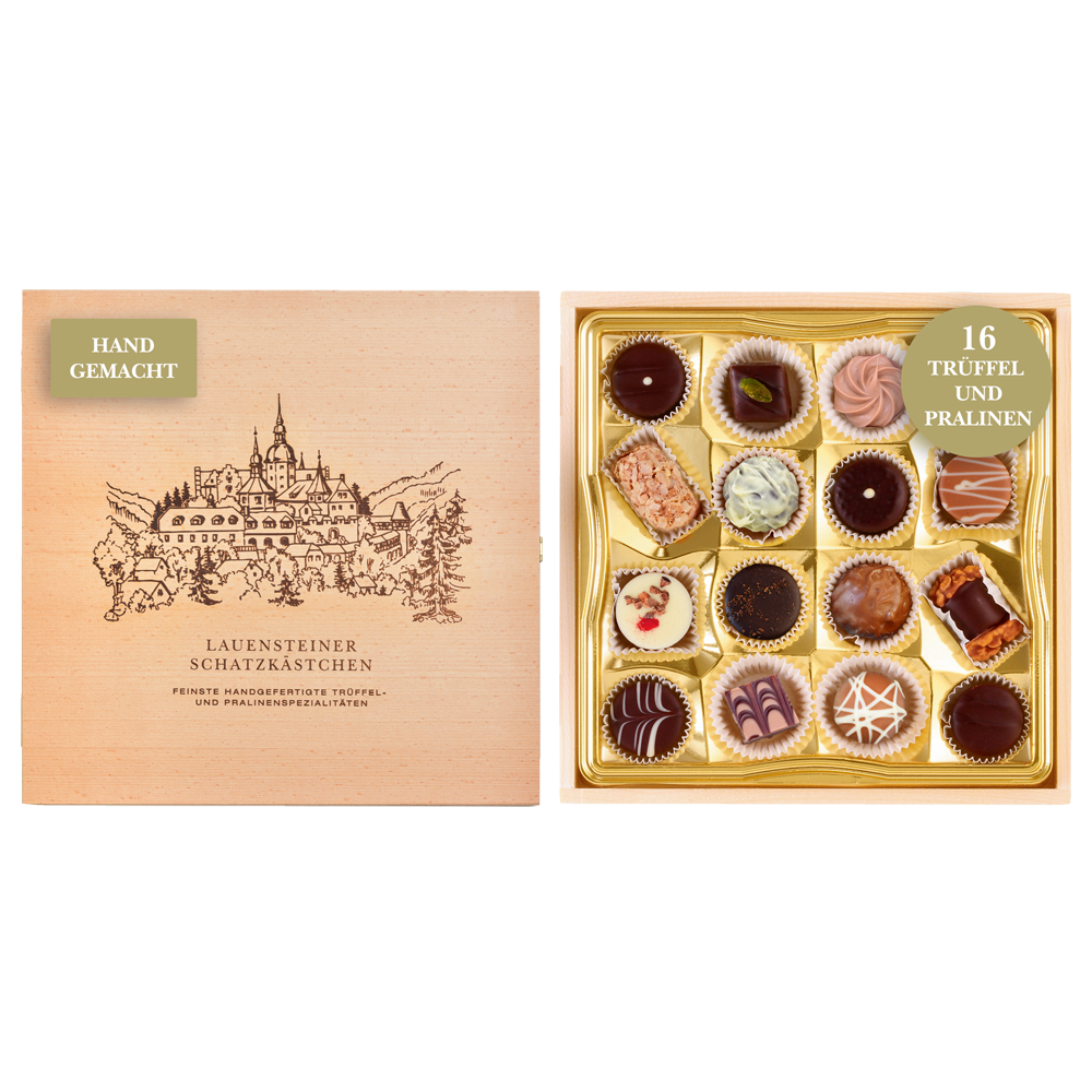 Geöffnetes Lauensteiner Schatzkästchen aus Buchenholz mit Abbildung der Burg Lauenstein und 16 verschiedenen Pralinen 
