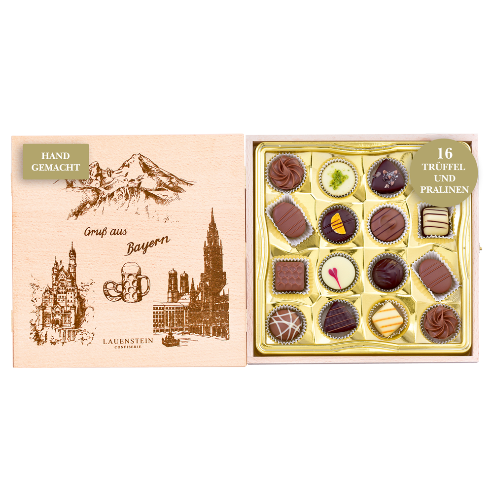 Geöffnetes Holzkästchen mit Grafiken bayerischer Sehenswürdigkeiten und 16 Pralinen handgefertigten Trüffeln und Pralinen von Lauenstein