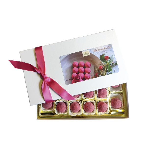 Handgemachte Himbeer-Trüffel in einer eleganten Geschenkbox mit pinker Schleife und 16 runden, pink-gepuderten Pralinen