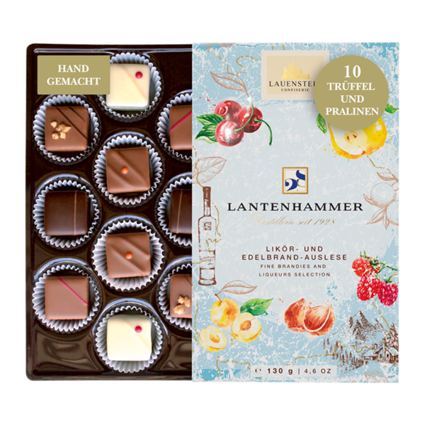 Geöffnete Lauenstein Lantenhammer Pralinenbox mit zehn Likör-Trüffeln und fruchtigen Illustrationen auf der Verpackung