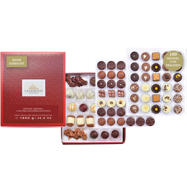 Elegante rote Pralinenschachtel von Lauenstein mit erlesenen Trüffeln und kunstvoll dekorierten Schokoladenpralinen in verschiedenen Sorten und Formen.  