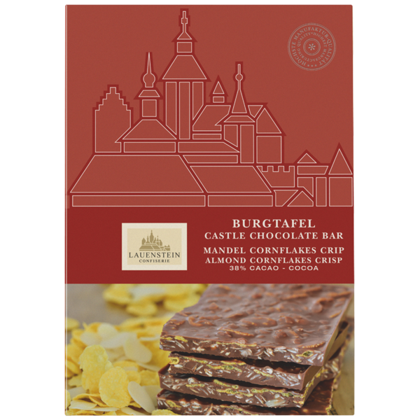 Rote Lauensteiner Schokoladenverpackung mit Burg-Illustration und gestapelten Mandel-Cornflakes-Vollmilch-Schokostücken