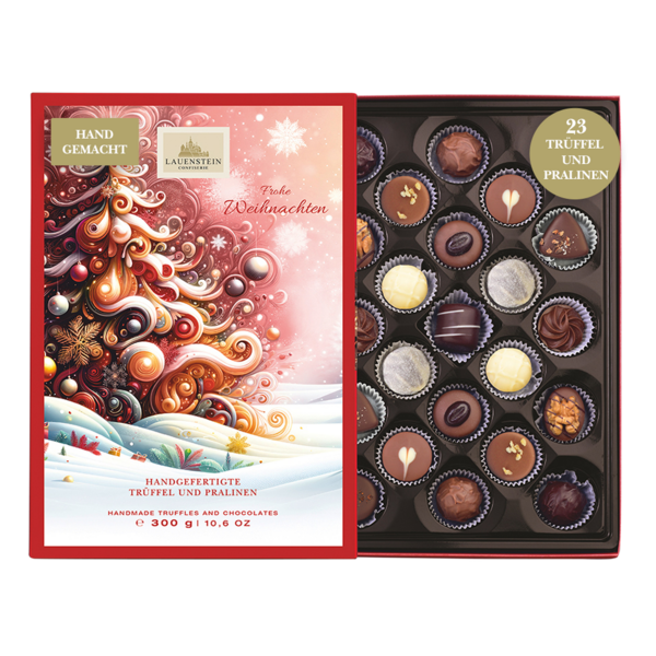 Geöffnete Lauenstein Geschenkpackung mit weihnachtlichem Einschieber und Aufschrift Frohe Weihnachten sowie 23 sortierten Pralinen
