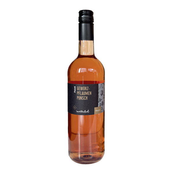 Flasche Wajos Gewürz-Pflaumen-Punsch daneben liegen frische Pflaumen 