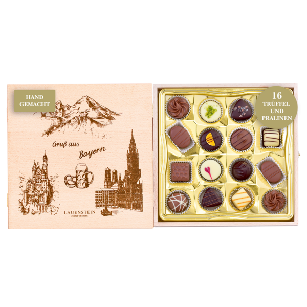 Geöffnetes Holzkästchen mit Grafiken bayerischer Sehenswürdigkeiten und 16 Pralinen handgefertigten Trüffeln und Pralinen von Lauenstein
